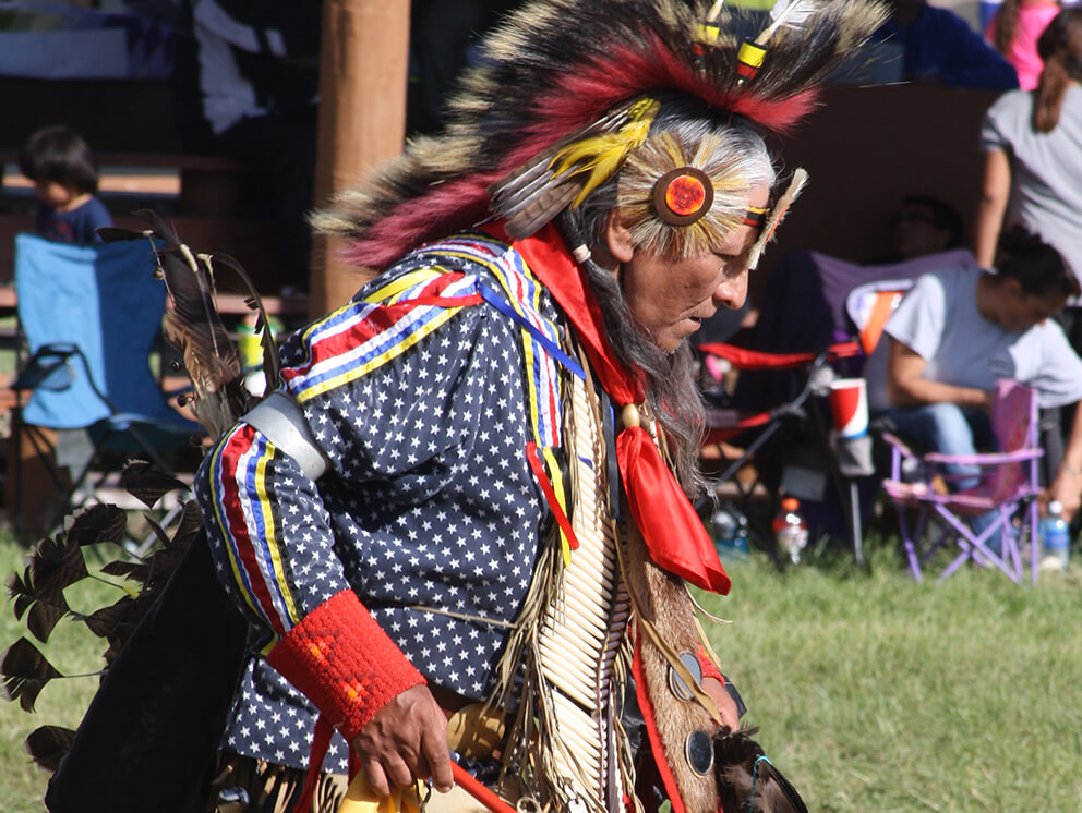 man performing a Native American dance